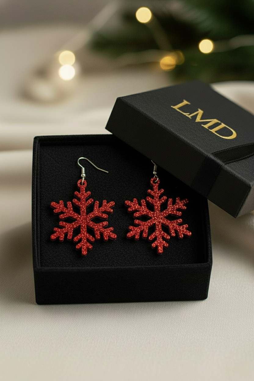 Red glitter snowflake earrings in LMD box with full black velvet interior